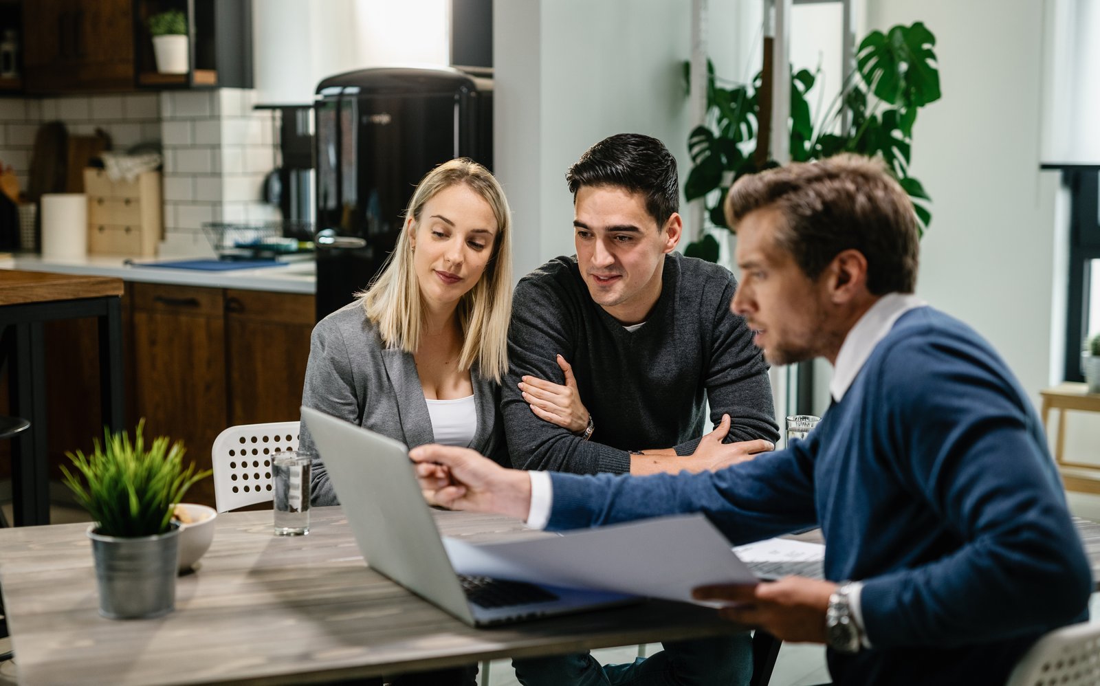 A couple exploring healthcare coverage with an adviser